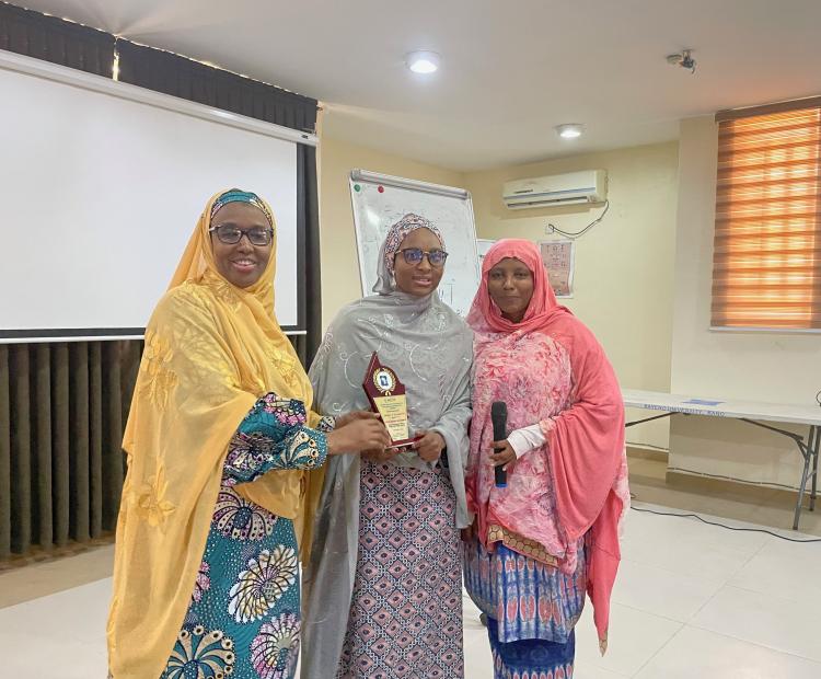 ACEPHAP Director, Prof. Galadanci (1st left) with one of the best researcher (middle) displaying the award